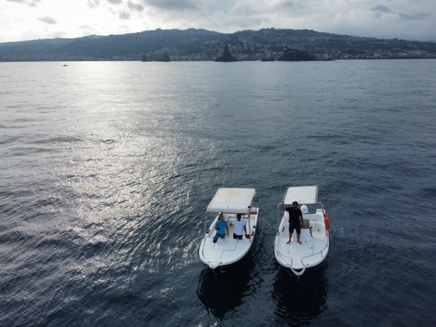 boat tour exploring and searching for dolphins in Acitrezza - Lachea Island and a protected volcanic setting