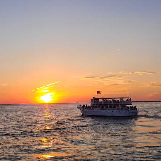 Destin: Sunset Dolphin Cruise - Boarding at Destin Harbor beside Margaritaville
