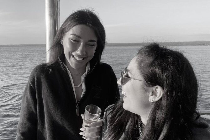 Dolphin Watching & Sunset Boat Tour With Dinner and Drinks - Watching the sunset over Pula
