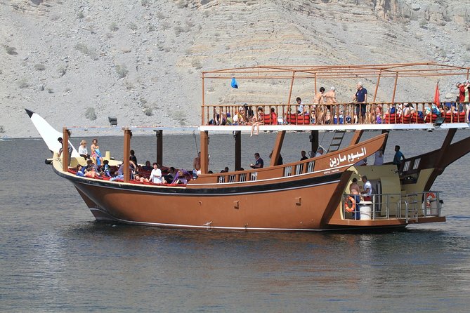 Half Day Dolphin Watching Musandam Dhow Cruise - Dolphin watching beside the boat