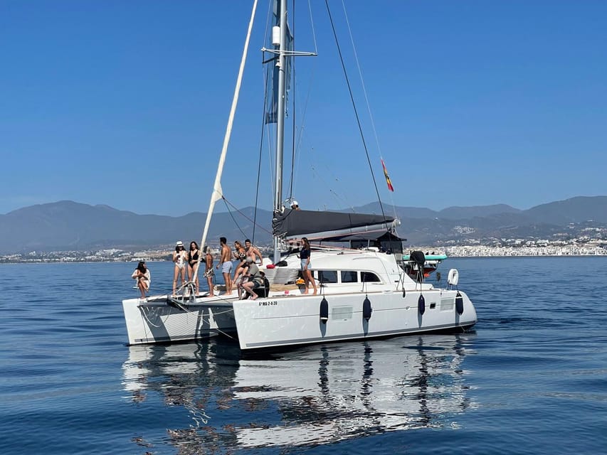 Marbella: Group Dolphin Watching Catamaran Tour with Snacks - Setting Sail From Puerto José Banús