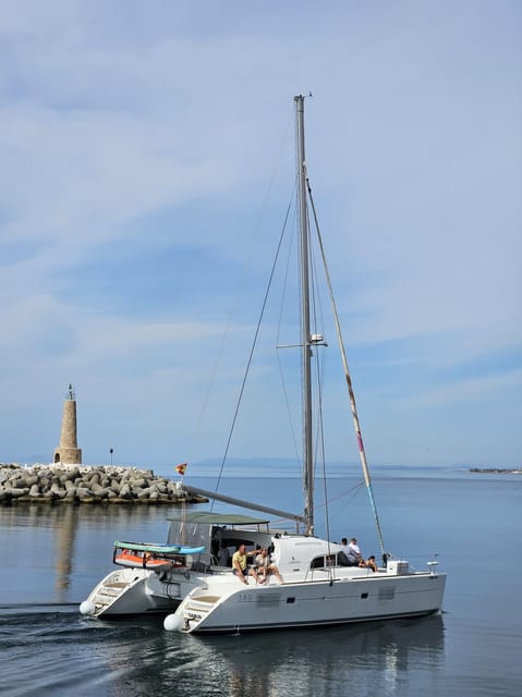 Marbella: Group Dolphin Watching Catamaran Tour with Snacks - The Swimming Stop and Water Toys