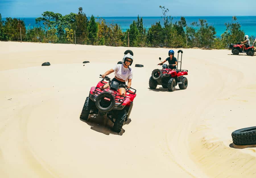 Moreton Island: Tangalooma ATV Quad Bike & Dolphin Feeding - Sunset sets up the dolphin program