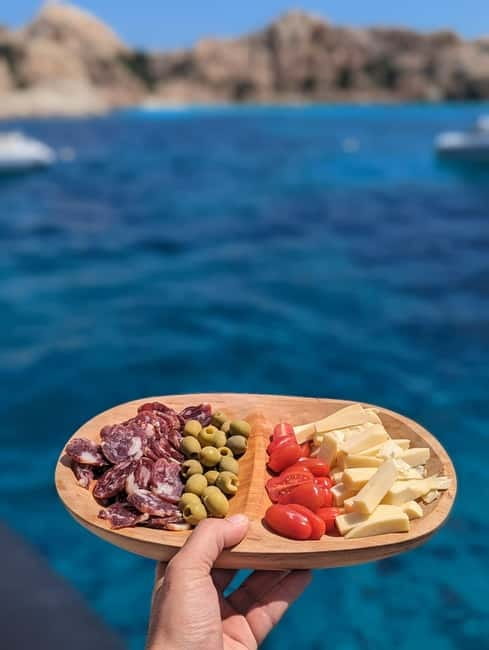 Olbia: Dolphin Watching & Snorkeling Boat Trip - Figarolo’s rocks and the aperitif stop
