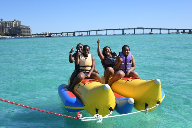 Private Banana Boat and Dolphin Spotting Experience - Getting fitted with a life jacket