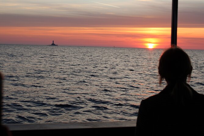 Private Sunset Dolphin Excursion with Dinner and Animation - Passing the Austro-Hungarian lighthouse