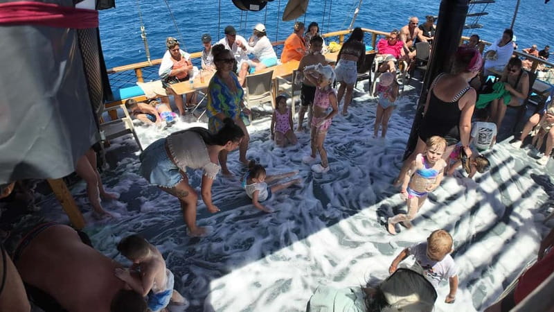 Side: Dolphin Boat Tour With Lunch Foam party Swimming - Crew, service, and the practical details