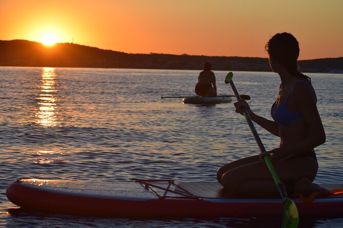 Stand Up Paddle With Dolphins, aperitif and pictures - Claudia and Fabio shape the experience