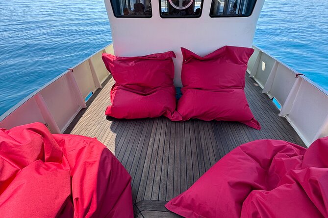 Sunset with dolphins on a vintage tugboat in Golfo Aranci - Sailing from Golfo Aranci toward Cala Moresca