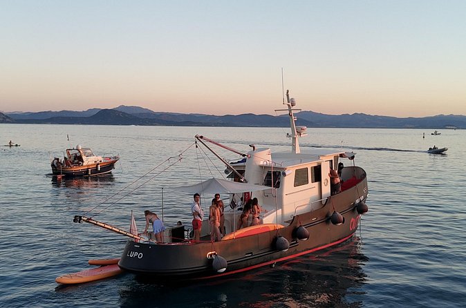 Sunset with dolphins on a vintage tugboat in Golfo Aranci - Sardinian wine and a sunset aperitif