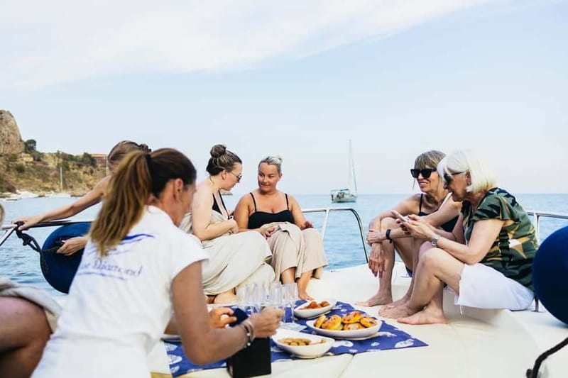 Taormina: Sunset Boat Tour with Dolphin Watching & Aperitif - Fruit, snacks, and an Italian-style aperitif