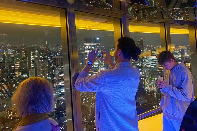 Tokyo Night E-Bike Tour with Tokyo Tower and Dolphin Show - Riding an electric bike through Minato after dark
